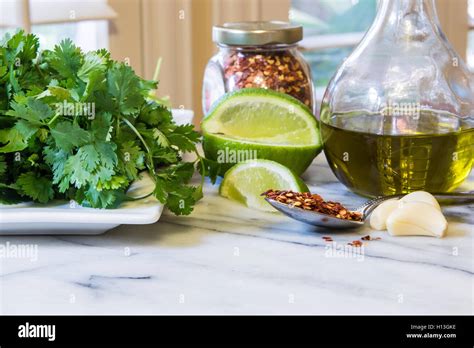 Mexican Food Ingredients In A Kitchen On A Marble Top Cilantro Red
