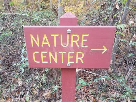 Red Nature Center Sign With Right Yellow Arrow Stock Photo Image Of