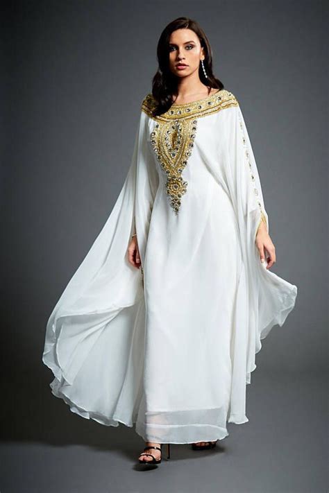 this luxurious design thats sure to turn heads this full length gown flows over curves and