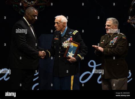 Secretary Of Defense Lloyd J Austin Iii Presents The Medal Of Honor Flag To Army Maj John J