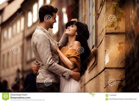 Passionate Gorgeous Young Couple Embrace Each Other While Walk Across