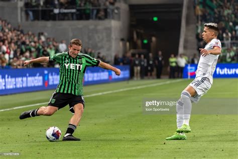 Austin Fc Midfielder Alex Ring Passes The Ball Into The Box While