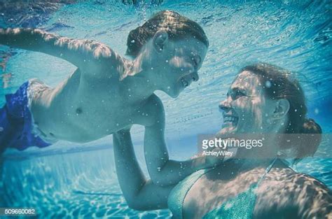 mom and son underwater photos and premium high res pictures getty images