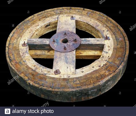 Old Wooden Aged Wheel From A Water Mill Isolated On Black Stock Photo
