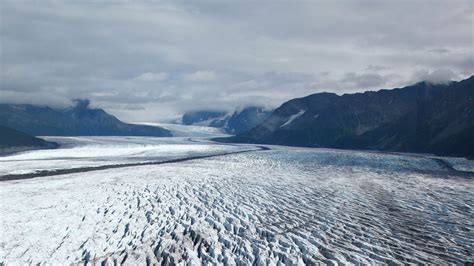 Download Wallpaper 1366x768 Glacier Ice Mountains Clouds Landscape