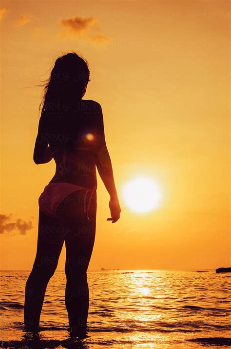 Silhouette Of A Hot Girl Standing On The Beach During Beautiful Sunset