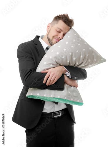 Young Business Man Hugging Pillow And Continuing To Sleep Isolated On
