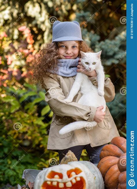 Beautiful Little Girl With Pumpkins In Autumn Park Stock Photo Image