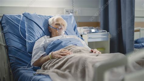 Man Wearing Oxygen Mask In Hospital Bed Stock Image F Science Photo Library