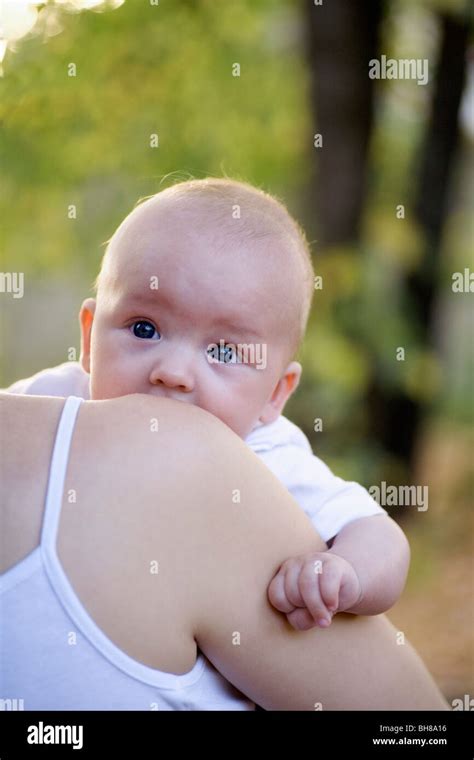 Close Up Of A Mother Carrying Her Baby Boy Hi Res Stock Photography And