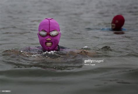 Chinese Women Wear Face Kinis As They Swim At The Beach On August 20