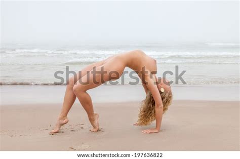 Nude Gymnastics Beautiful Woman Posing On Sea Beach In Foggy Day