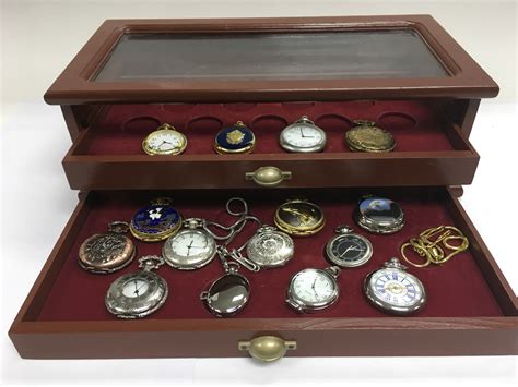 A Display Case Containing Various Pocket Watches
