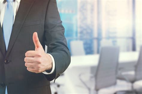 A Businessman Showing A Thumb Up Sign Standing In Office Panoramic