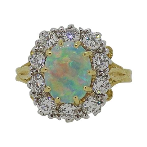Oval Opal And Diamond Claw Set Cluster Ring 18 Karat White Gold For