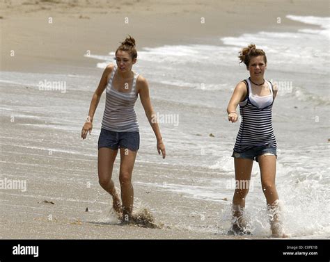 Miley Cyrus Relaxes On The Beach With A Friend While Filming The New