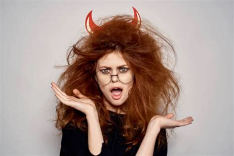Brunette In A Devil Costume On Halloween Red Horns Glasses Black Dress Stock Image Everypixel