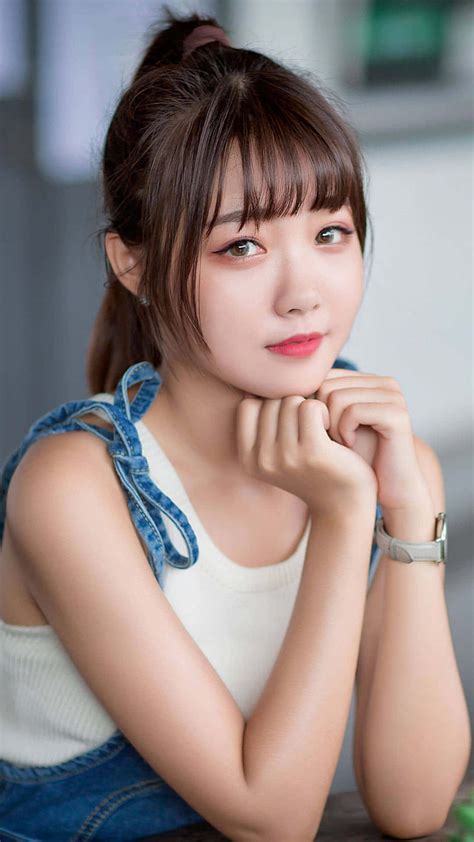 Download Cute Korean Girl Wearing A Denim Jumper Wallpaper