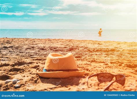 Hat And Glasses On The Sand On The Beach Stock Photo Image Of Seaside