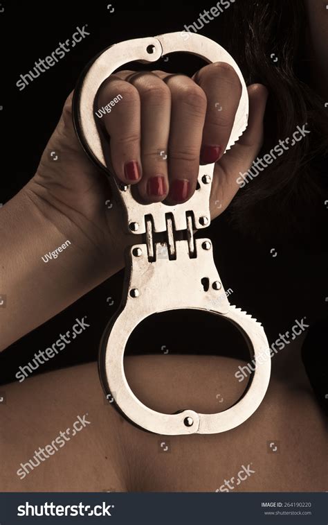 Handcuff Hand Dominant Mistress On Black Foto De Stock