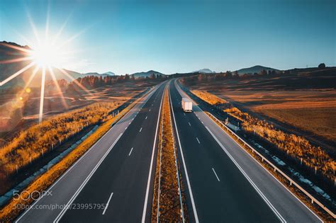 Driving On Open Road At Beautiful Sunny Day By Vall Aerial View Open