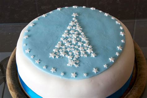 Big new year's or wedding cake on lightly decorated background. Christmas Cake Decorating - A Simple Life of Luxury