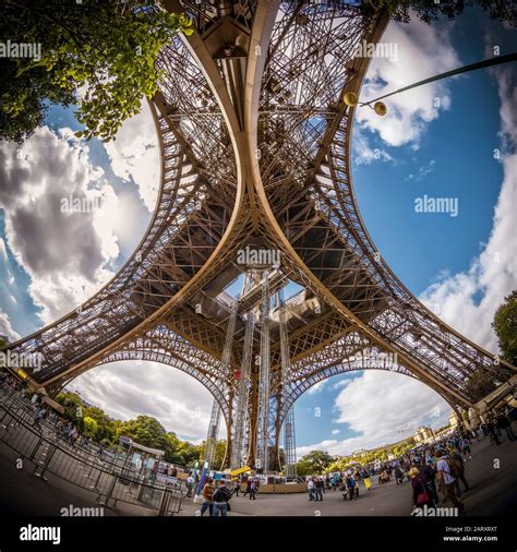 The Bottom View Of Eiffel Tower In Paris France Under The Arches Of