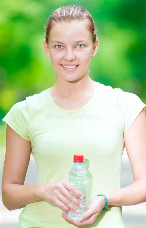 Woman Drinking Cold Mineral Water From A Bottle After Fitness Ex Stock