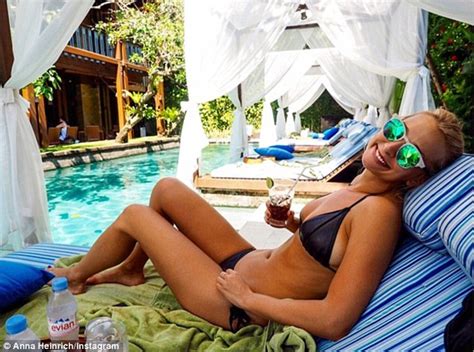 Anna Heinrich Shows Off Her Toned Body In A Black Bikini As She Enjoys A Relaxing Session In A