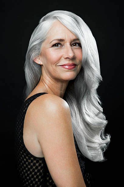 Portrait Of A Woman With Long Wavy Silver Gray Hair Looking Over Silver Grey Hair Long