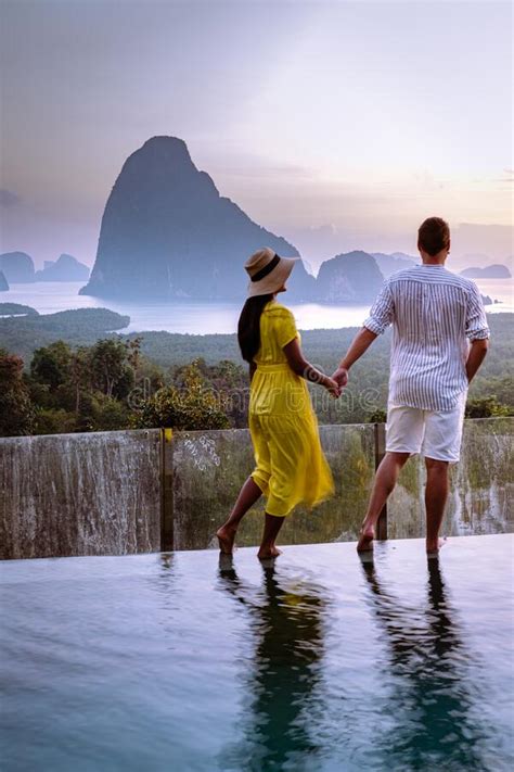 Phangnga Bay Thailand Couple On The Edge Of An Swimming Pool Watching Sunrise Thailand Infinity