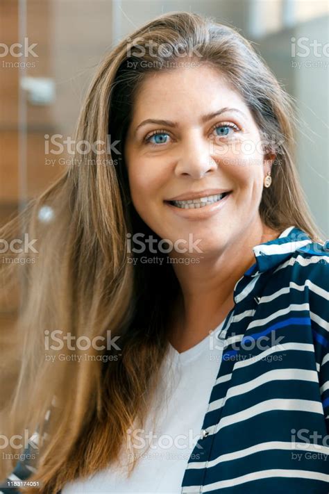 Smiling Portrait Of Beautiful Mature Woman Stock Photo Download Image