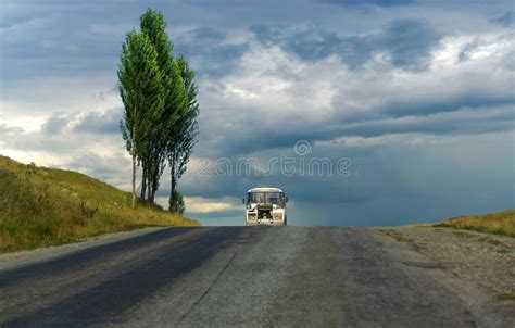 Old Bus Going Along A Mountain Road Stock Photo Image Of Highway