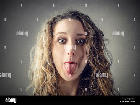 Young Beautiful Girl Sticking Tongue Fotos Und Bildmaterial In Hoher