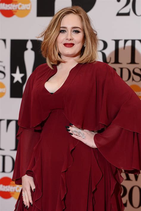 Adele reveals new look she lost 100 pounds! Why Adele's New Look at the Brit Awards Is the Perfect ...