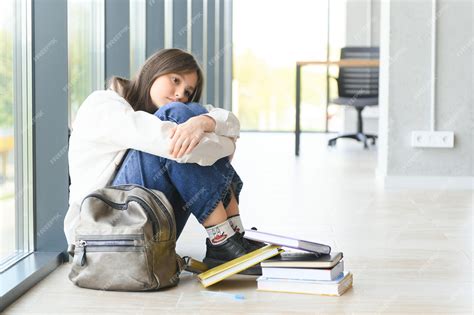 Premium Photo | Lonely sad schoolgirl while all her classmates ignored