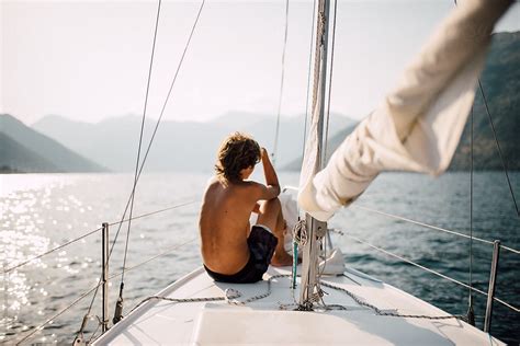 Young Boy Sitting On A Boat By Stocksy Contributor Boris Jovanovic