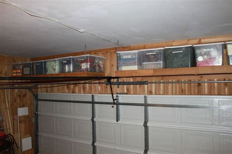 Shelves With Tubs Over Garage Door Garage Storage Plans Garage Wall