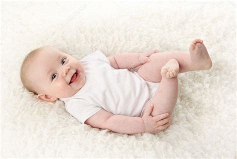 Baby Lying On Back Smiling With Feet In The Air — Stock Photo