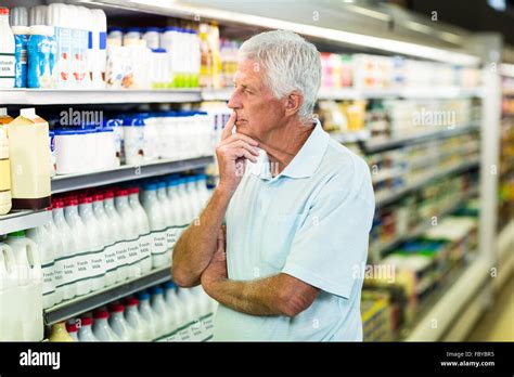 Senior Man Buying Milk Stock Photo Alamy