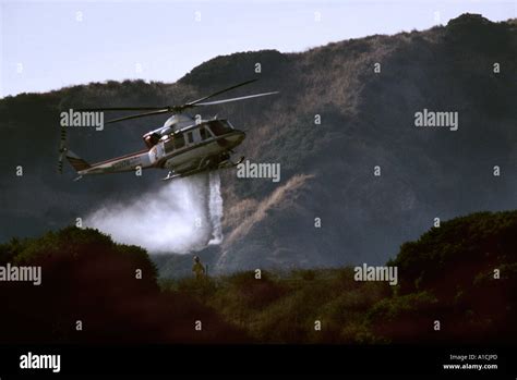Helicopter Dropping Fire Retardant On Brush Fire In Burbank Ca Stock