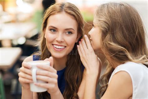 Young Women Drinking Coffee And Talking At Cafe Stock Photo Image Of