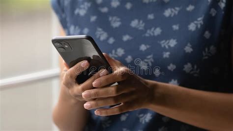 Modern Mobile Phone Device In Young African American Female Hands Stock