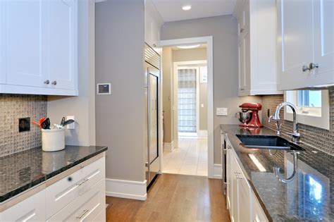 Including an island that interrupts your workflow or placing it in the wrong spot can be a disaster, especially in a smaller kitchen. Sumptuous granite cutting board in Kitchen Farmhouse with ...