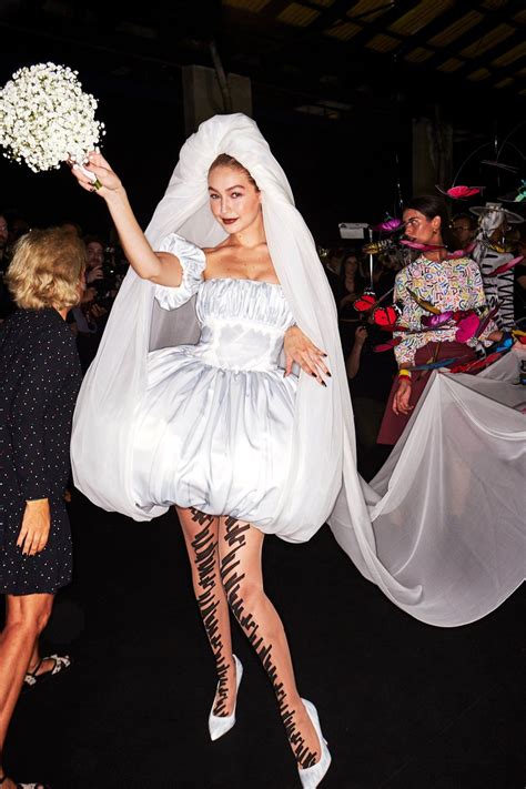 Gigi Hadid Wearing A Strapless Satin Bridal Dress By Moschino Ss19