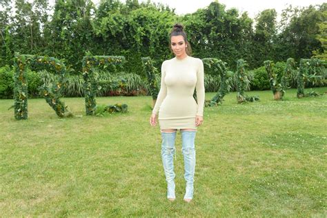 Kim Kardashian Wears Yeezy Thigh High Denim Boots At Revolves Party