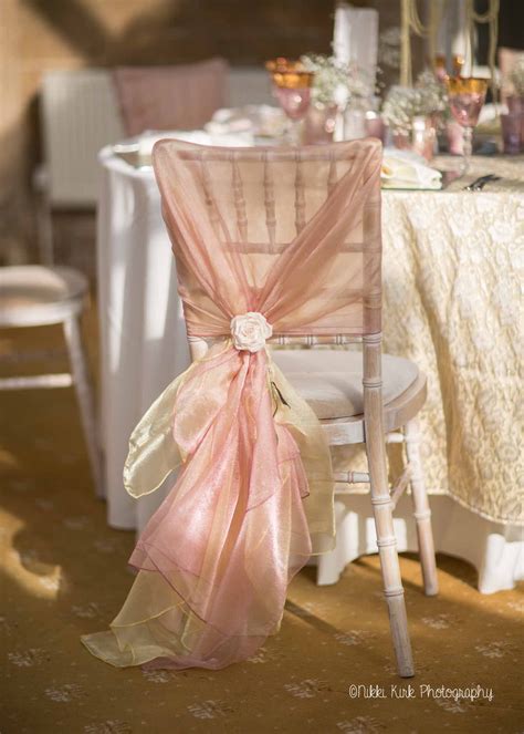 Chair covers are super affordable. A limewash chiavari chair with a hand tied dusky pink and ...