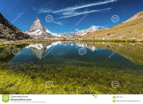 Matterhorn Mountain Behind A Beautiful Lake With Grass Stock Image