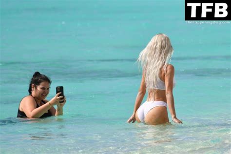 Kim Kardashian Shows Off Her Sexy Figure In A White Bikini During An