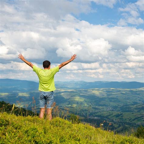 Man Standing On The Peak Of The Mountain Stock Photo Image Of Extreme